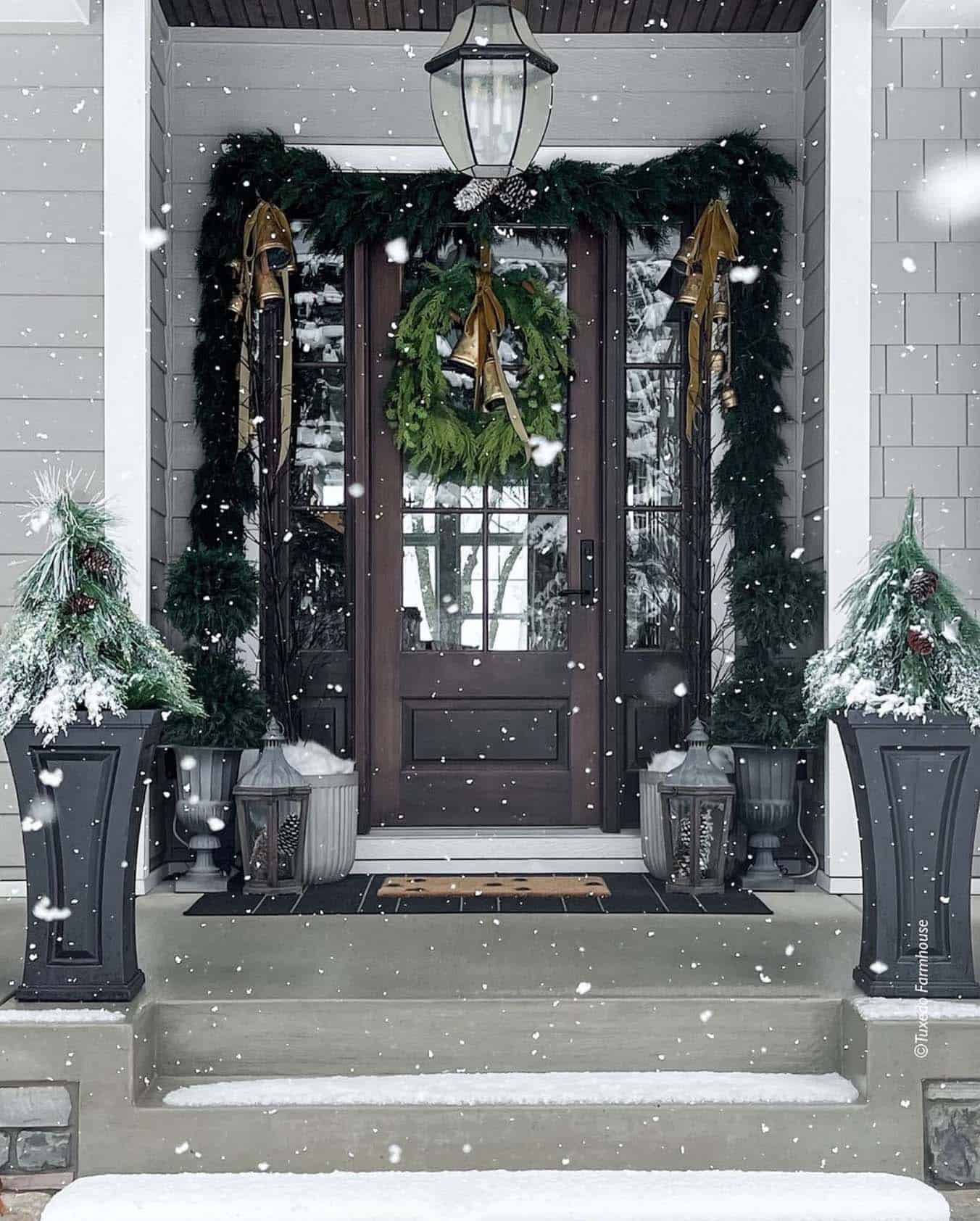 Christmas decorated front door with faux greenery
