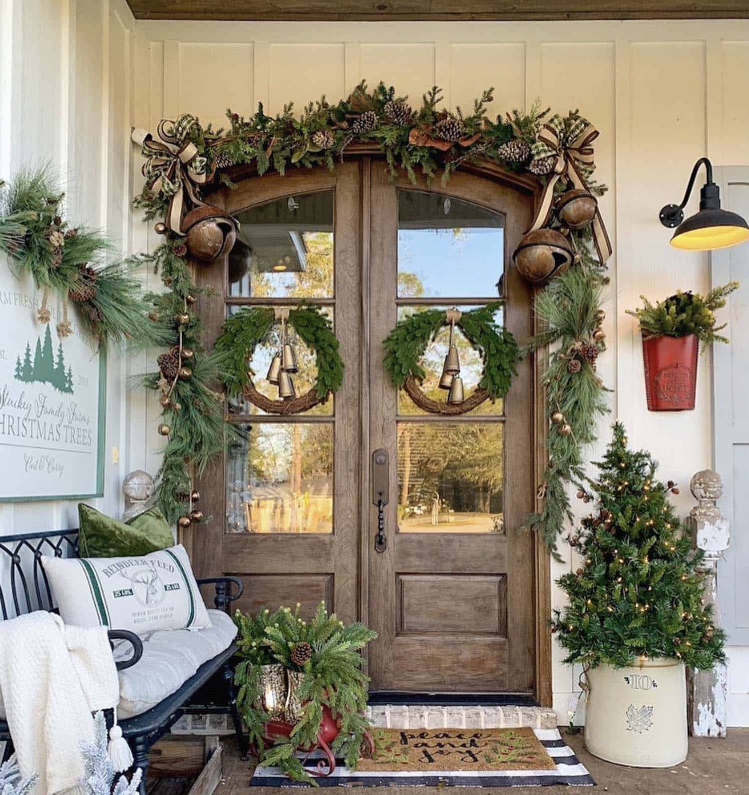 Christmas decorated front porch with a woodsy, natural, green theme