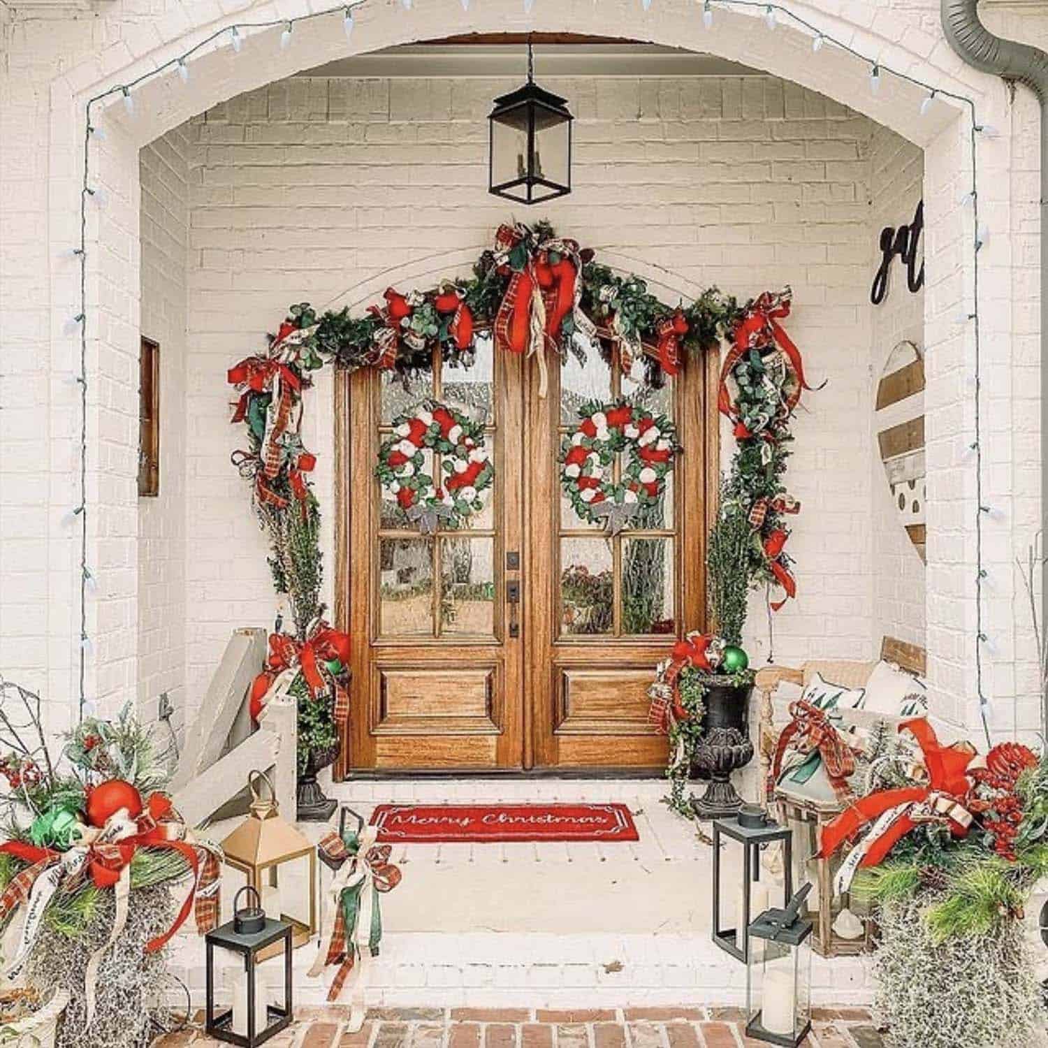 traditional red and green Christmas decorations on the front porch