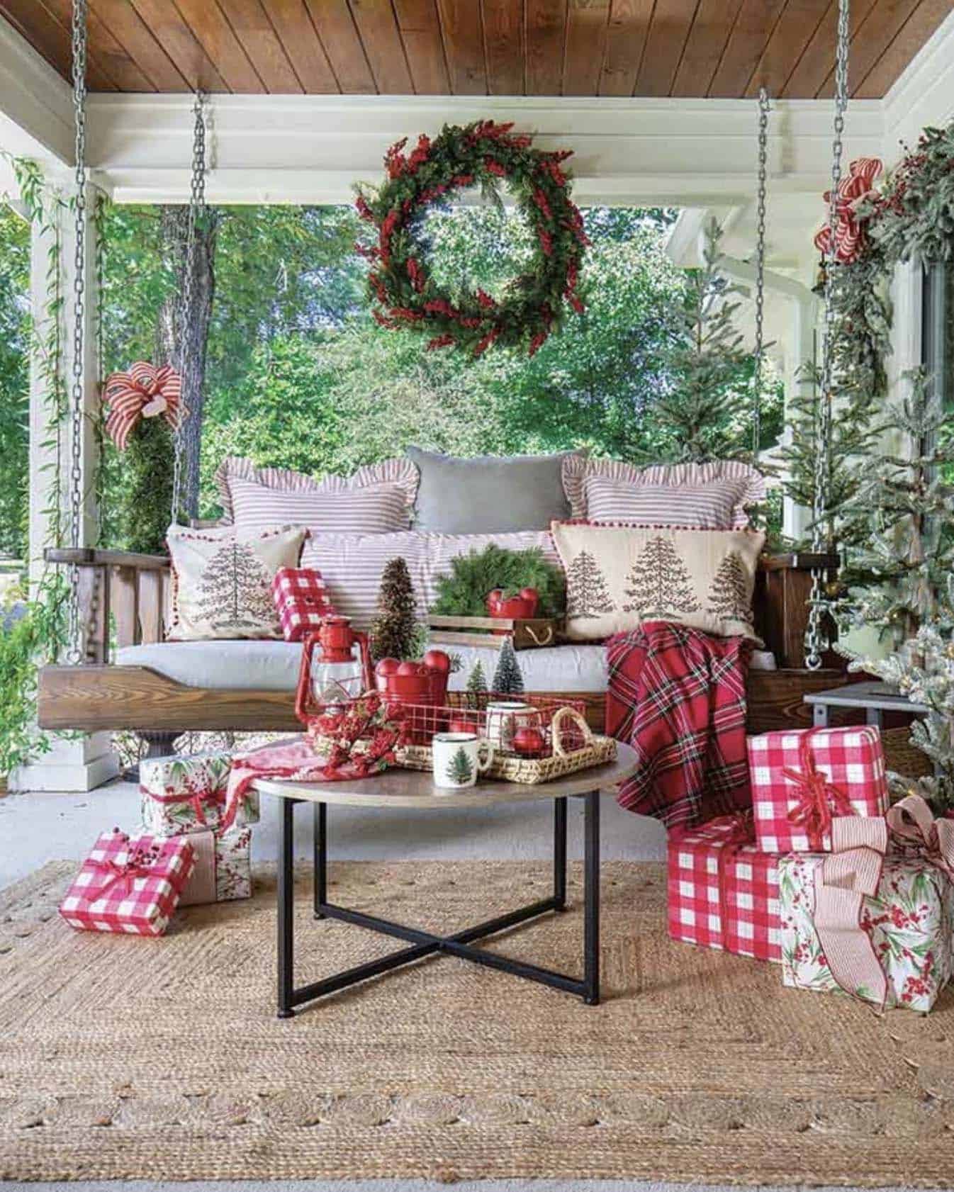 cozy Christmas decorated front porch with a hanging swing