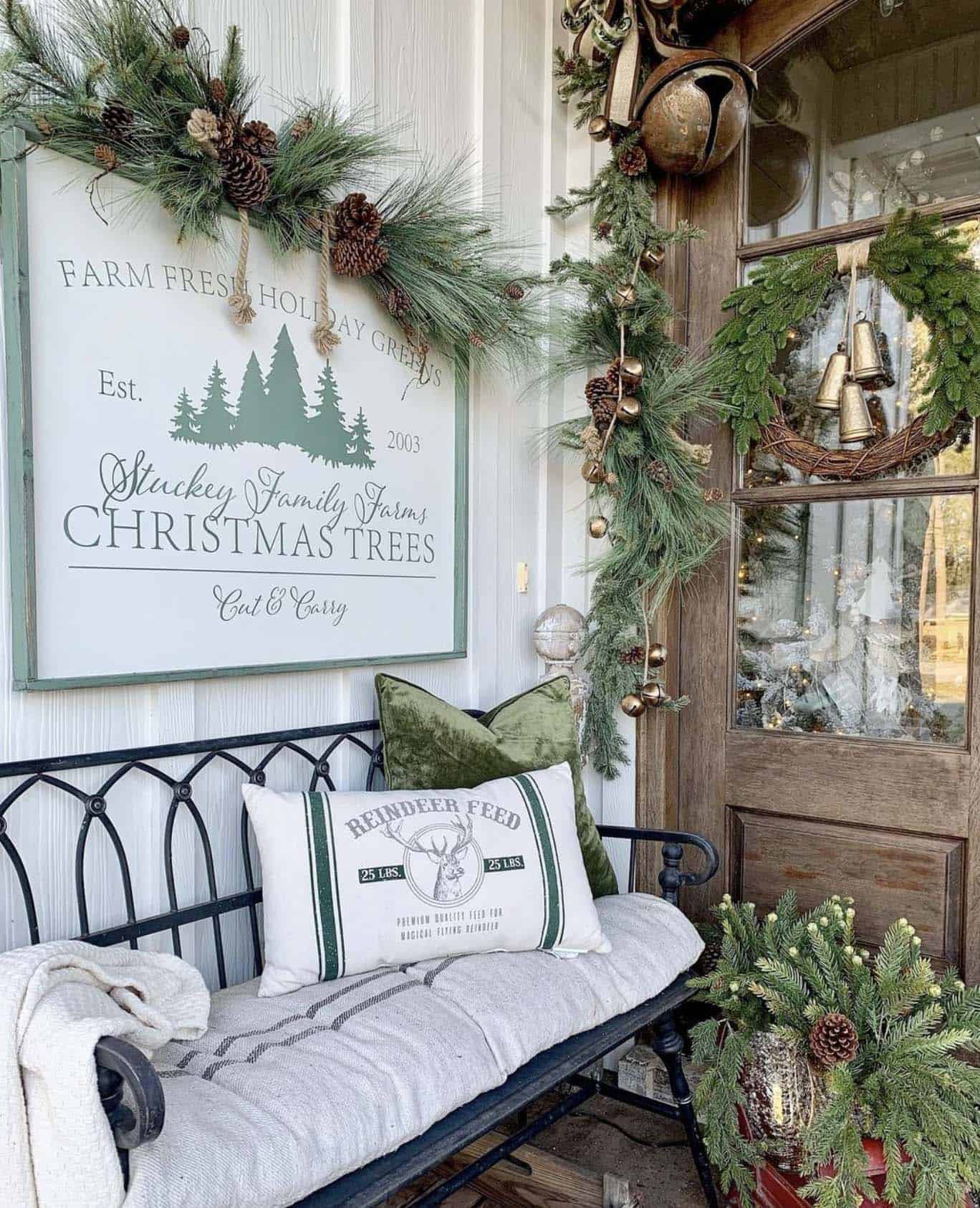 Christmas decorated front porch with a woodsy, natural, green theme