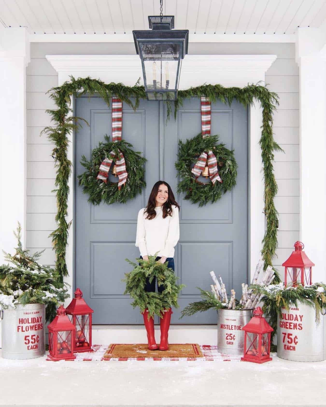 christmas decorated front porch with a traditional red and green theme