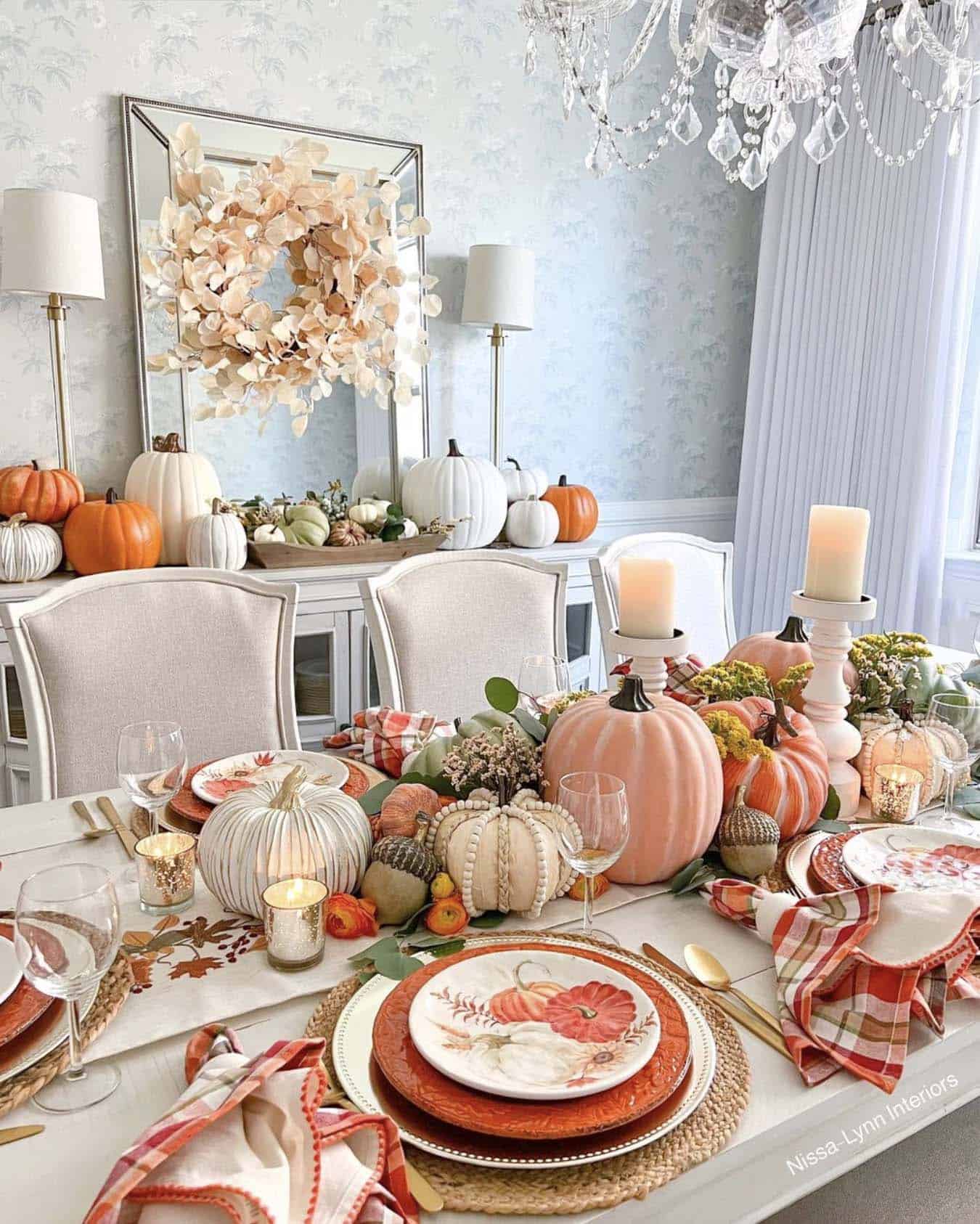 festive thanksgiving tablescape with a pumpkin and candle centerpiece
