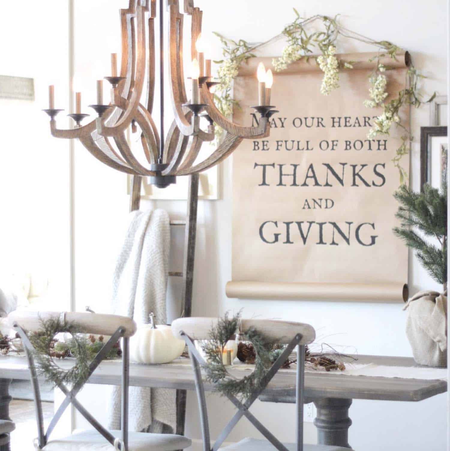 cozy neutral thanksgiving table with a scroll on the wall