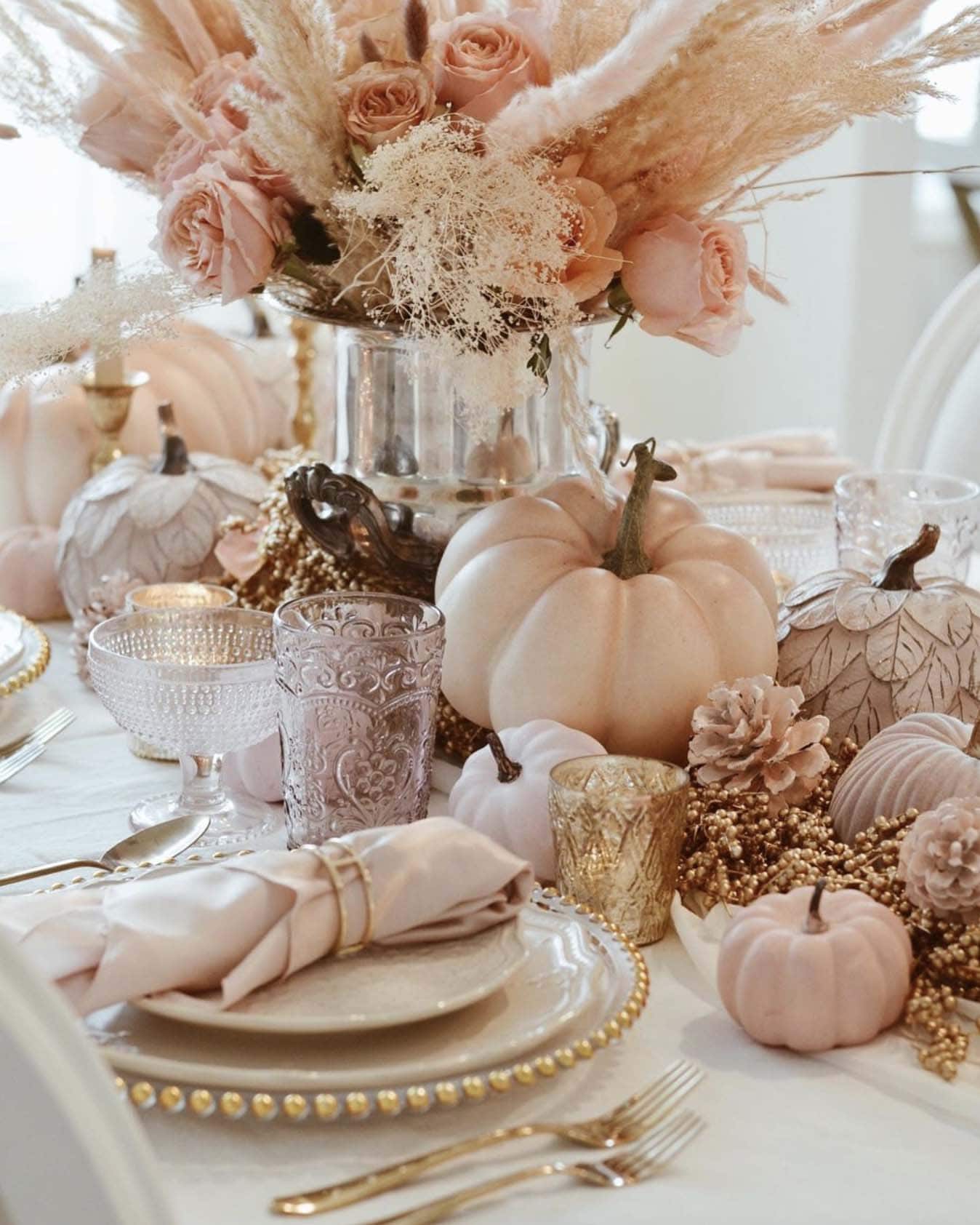 thanksgiving dining table decor with a pastel color palette of florals and pumpkins