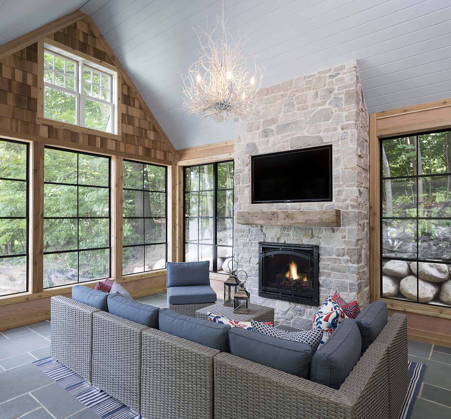 coastal farmhouse style screened porch with a fireplace
