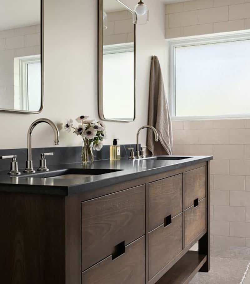 contemporary bathroom with a vanity and two sinks