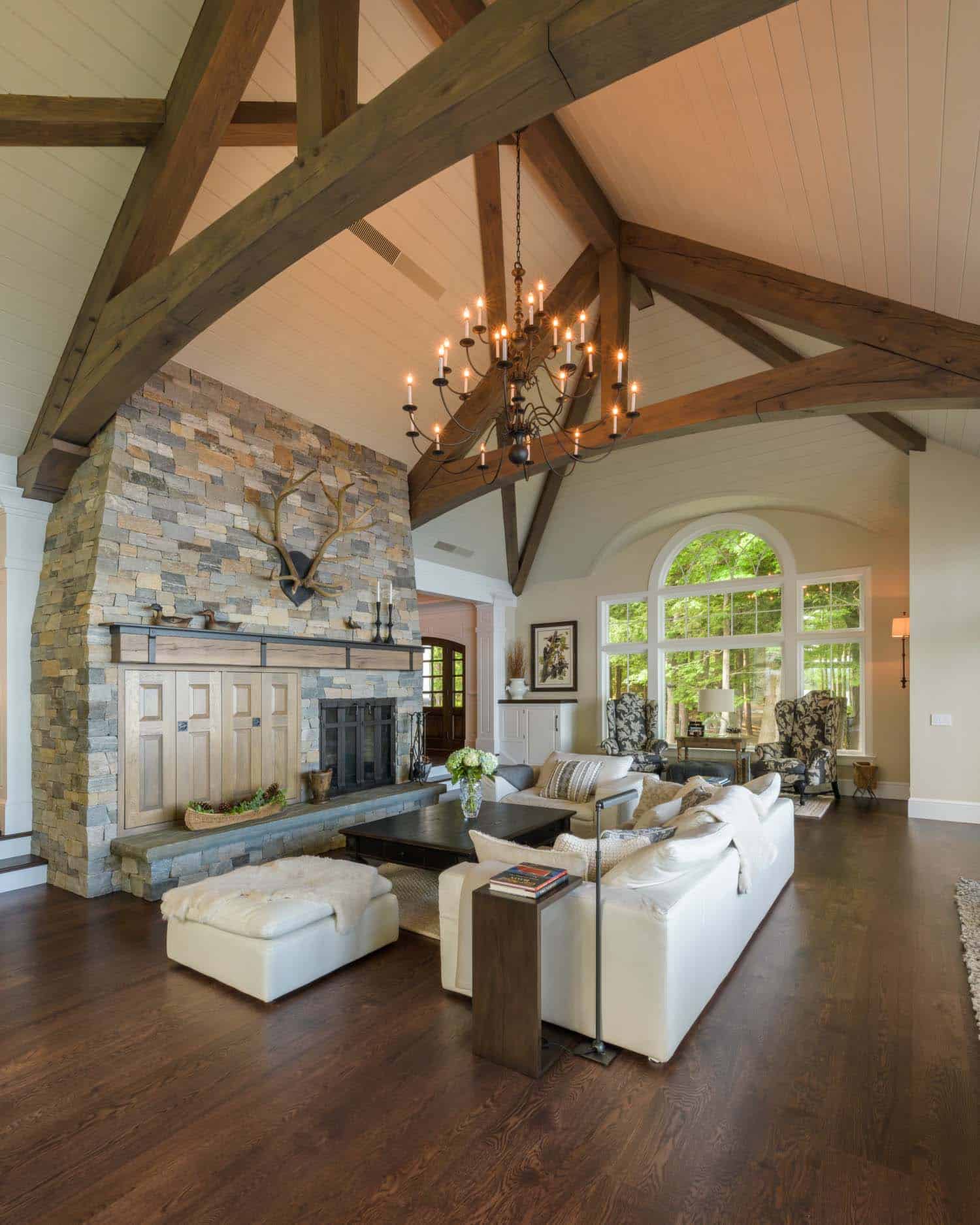 contemporary living room with a stone fireplace
