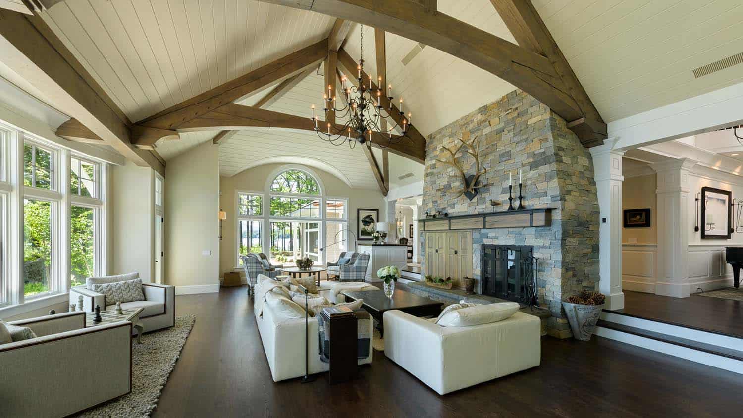 contemporary living room with a stone fireplace
