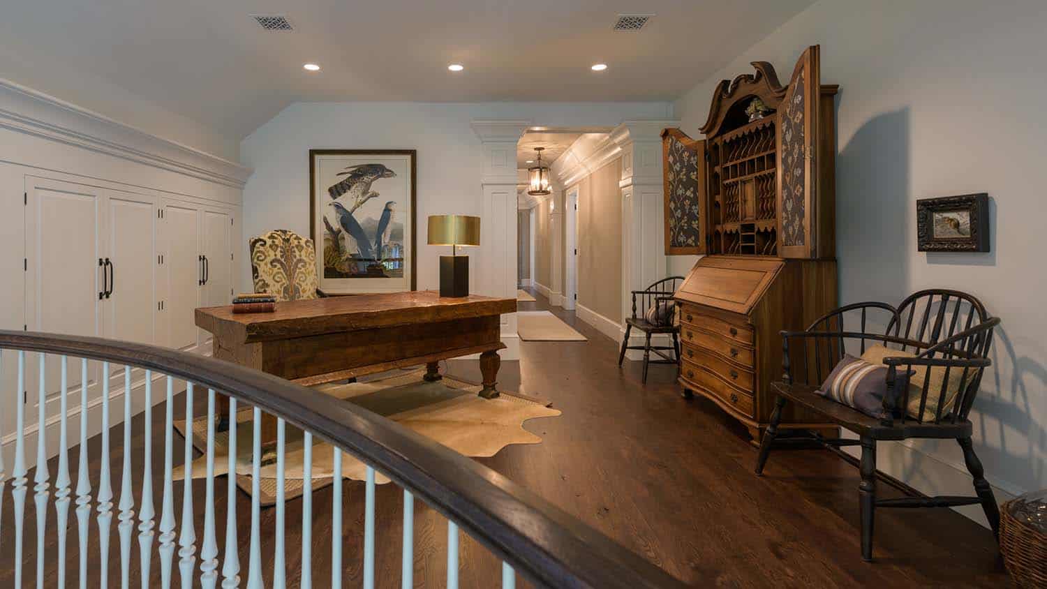 contemporary staircase landing with a desk