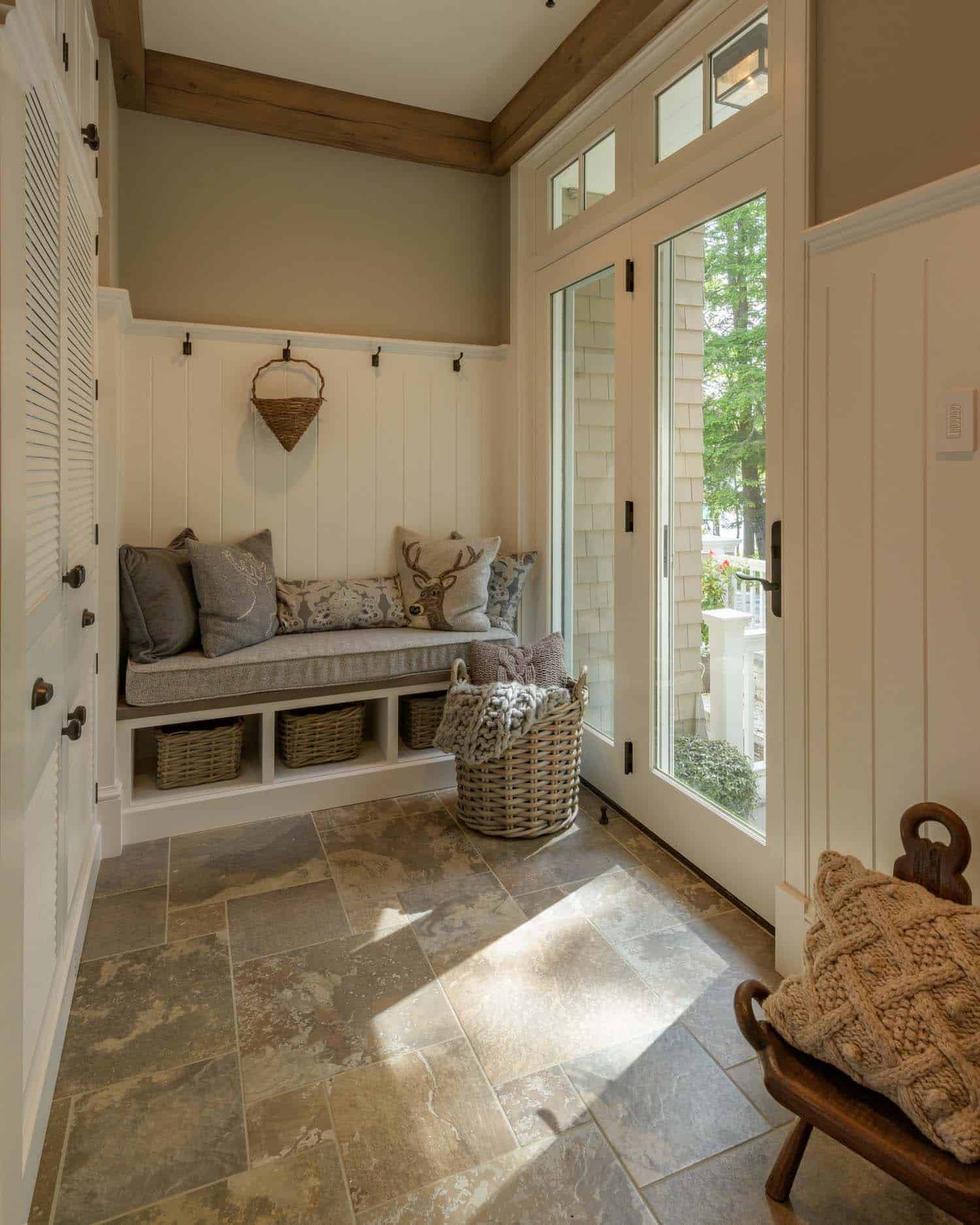 contemporary mudroom entry with a built-in bench and storage
