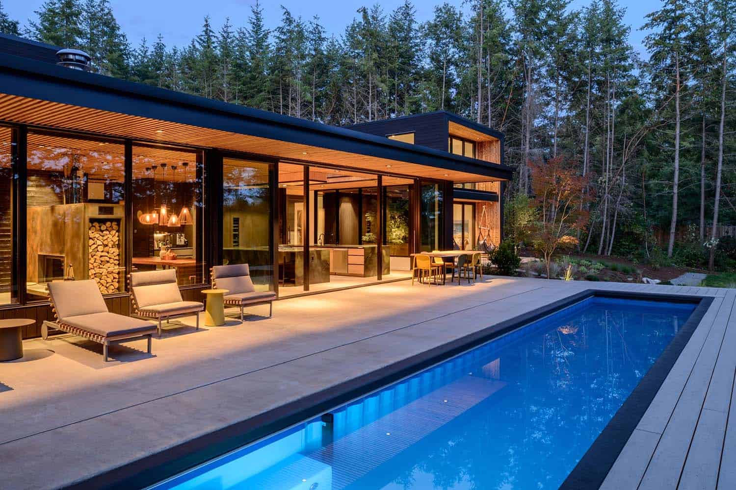 contemporary waterfront house exterior with a pool