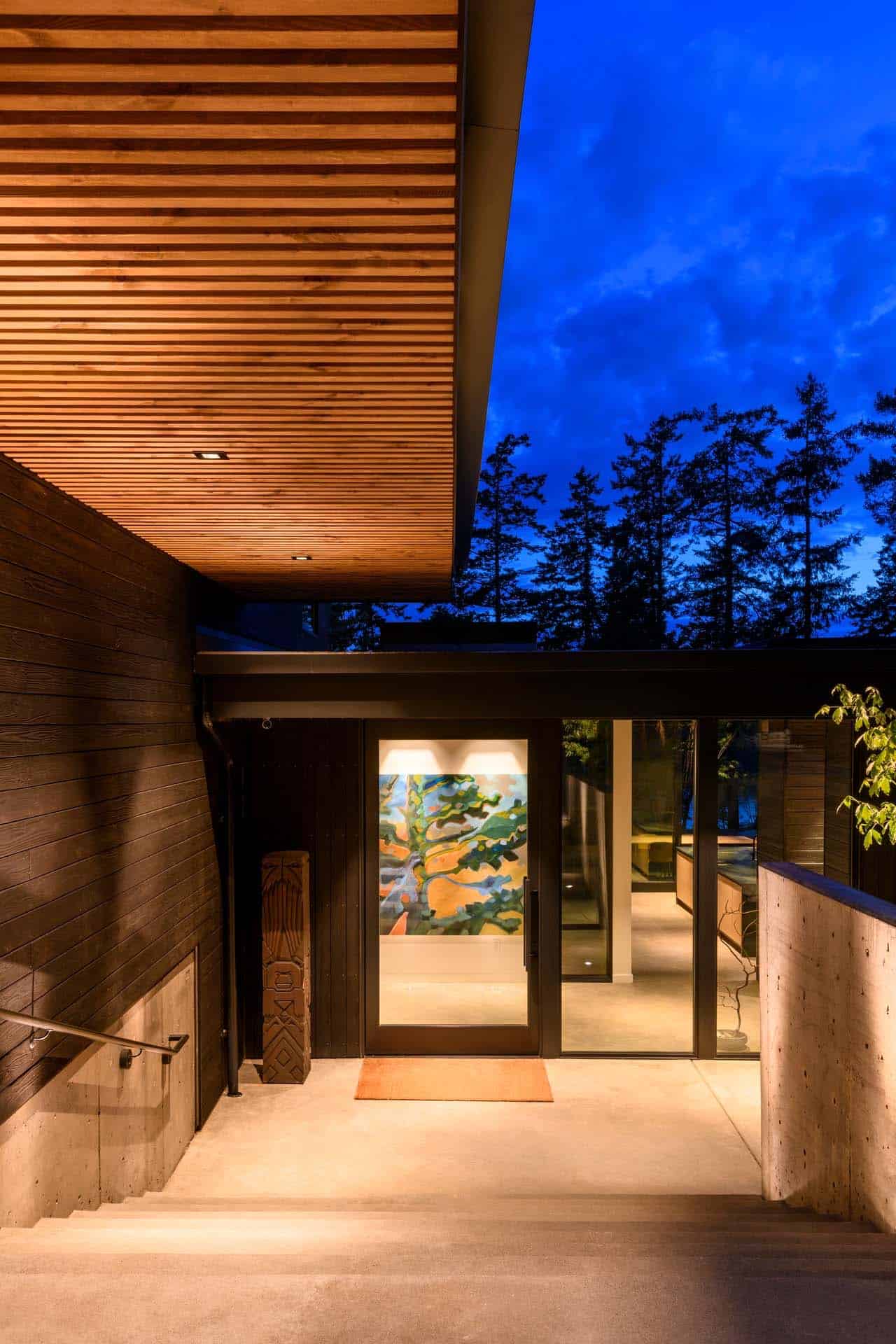 contemporary waterfront house exterior at dusk