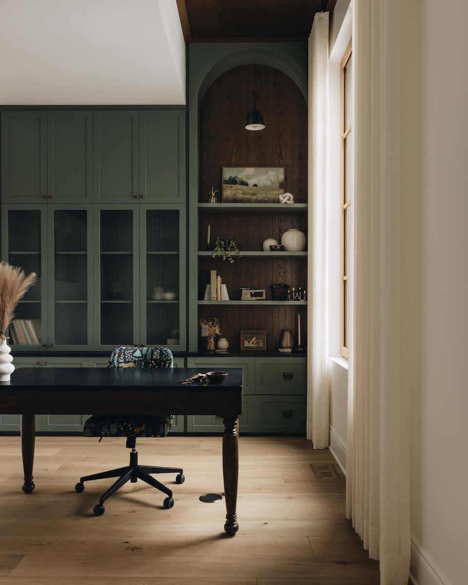 modern home office with olive green built-in cabinets