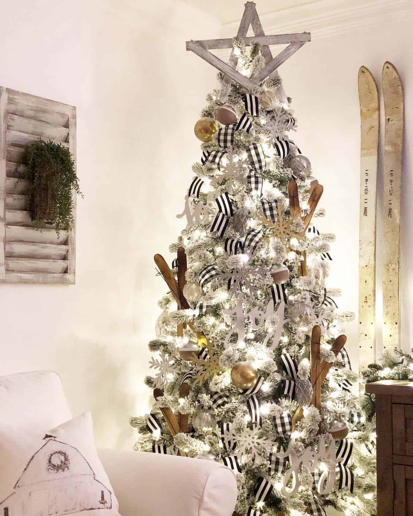 flocked Christmas tree with lights and wooden skis