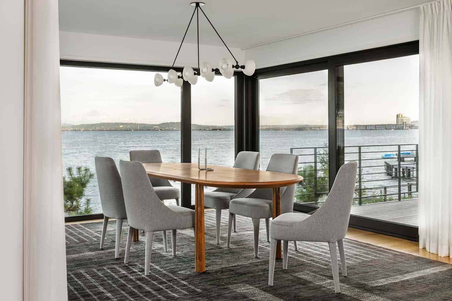 modern dining room with a water view