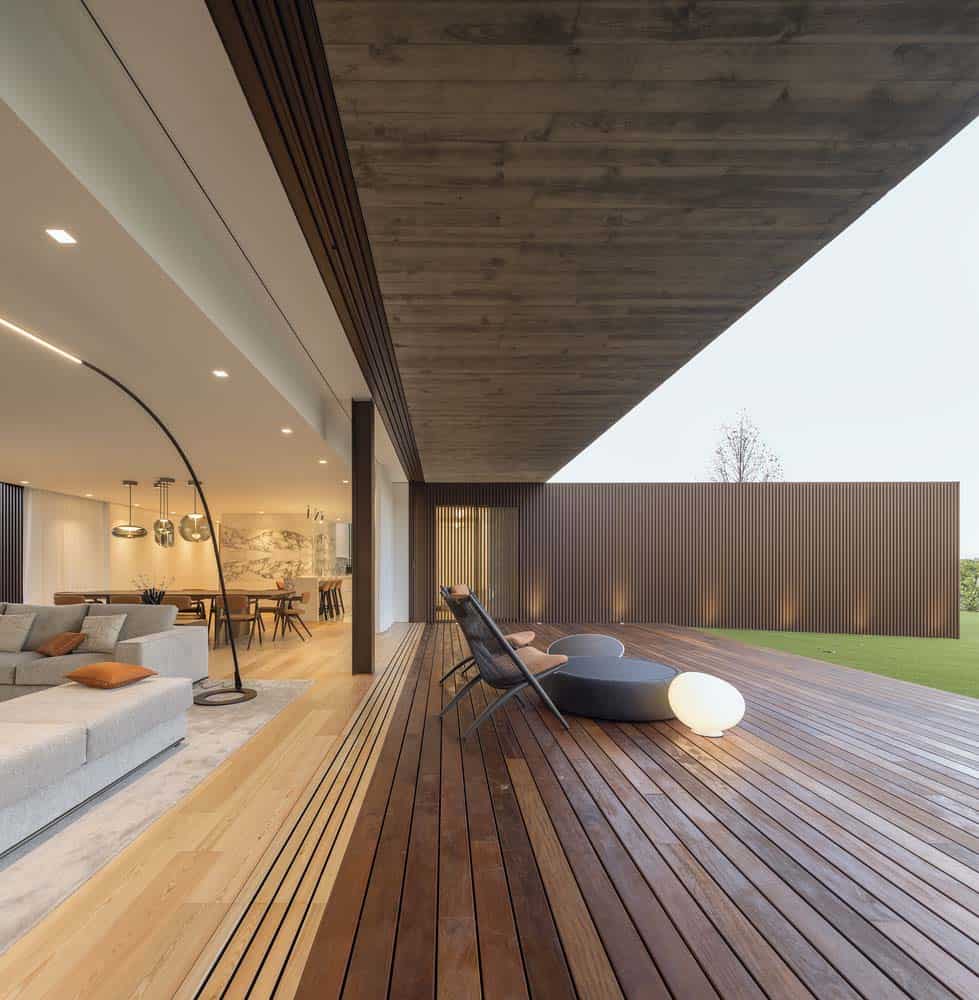 modern great room with glass walls that disappear for an indoor-outdoor connection