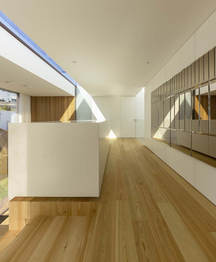 modern hallway with a skylight