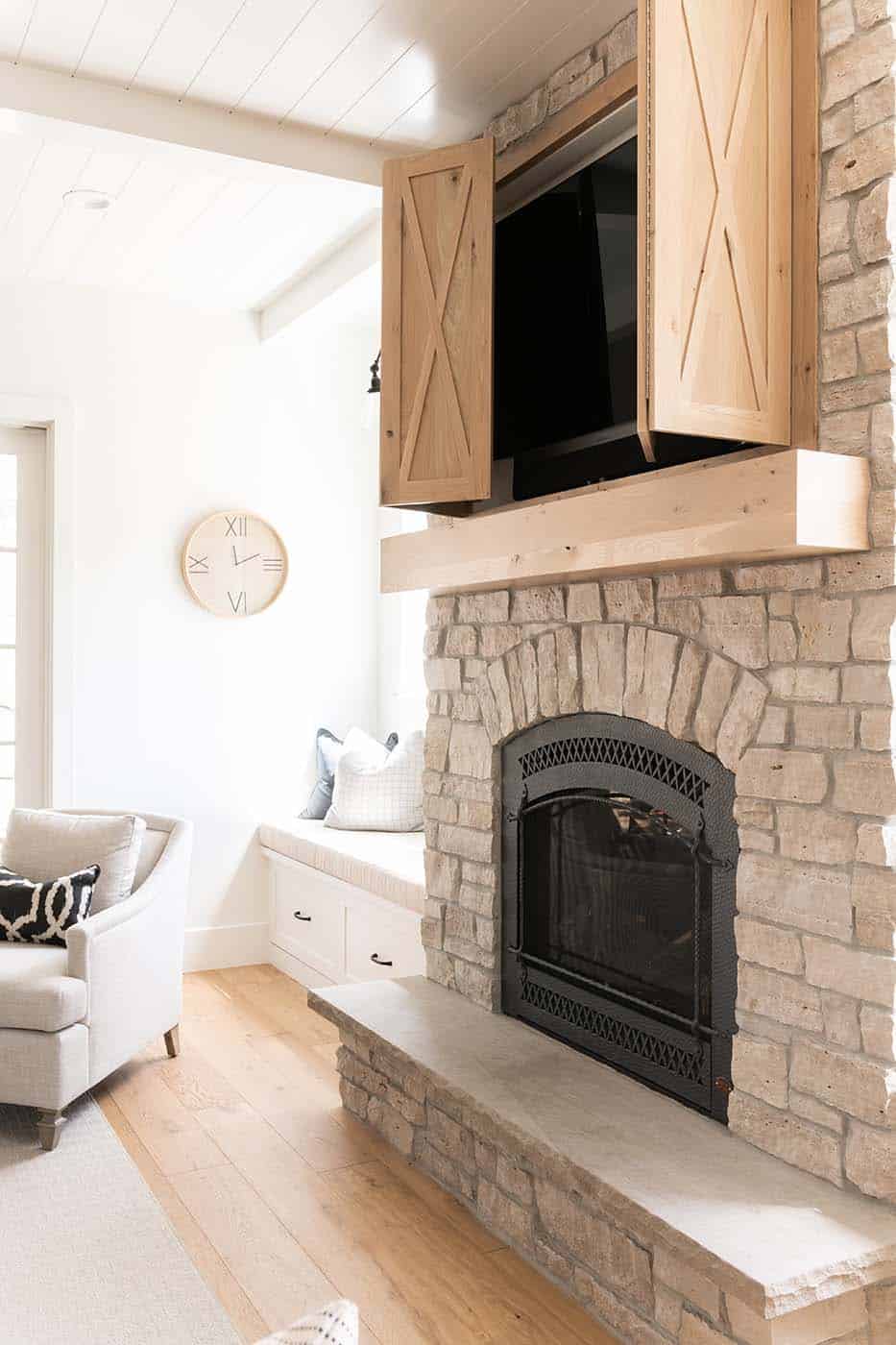 modern farmhouse living room fireplace detail with a concealed TV