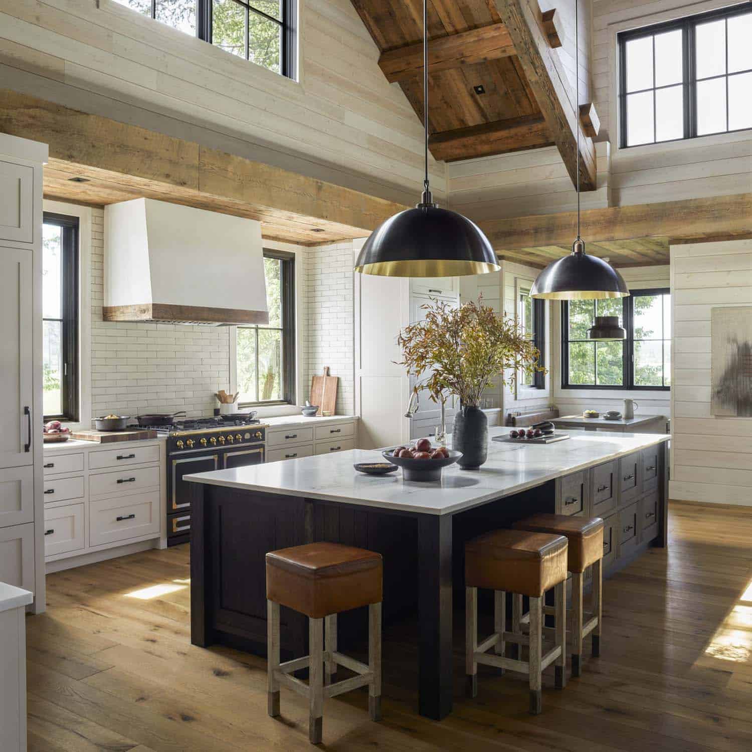 modern rustic kitchen with a large island and tall ceilings