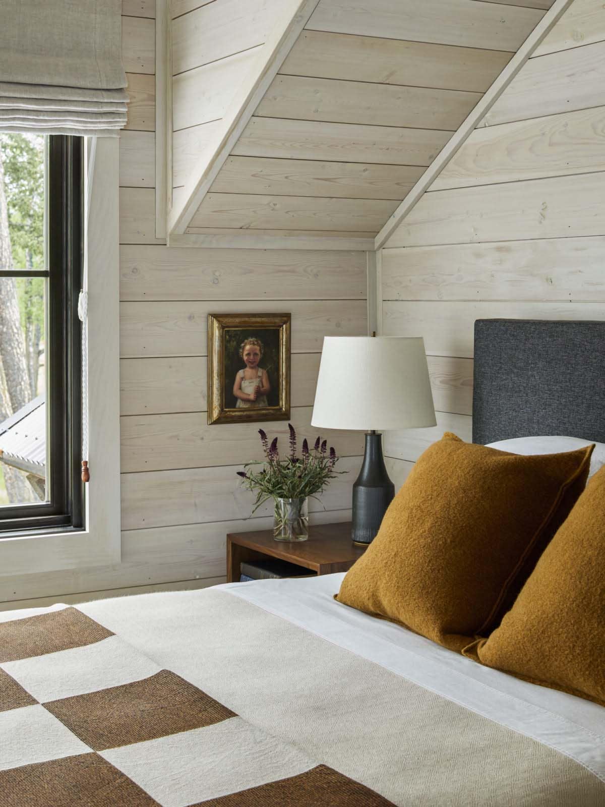 modern rustic bedroom with tongue and groove paneling in white