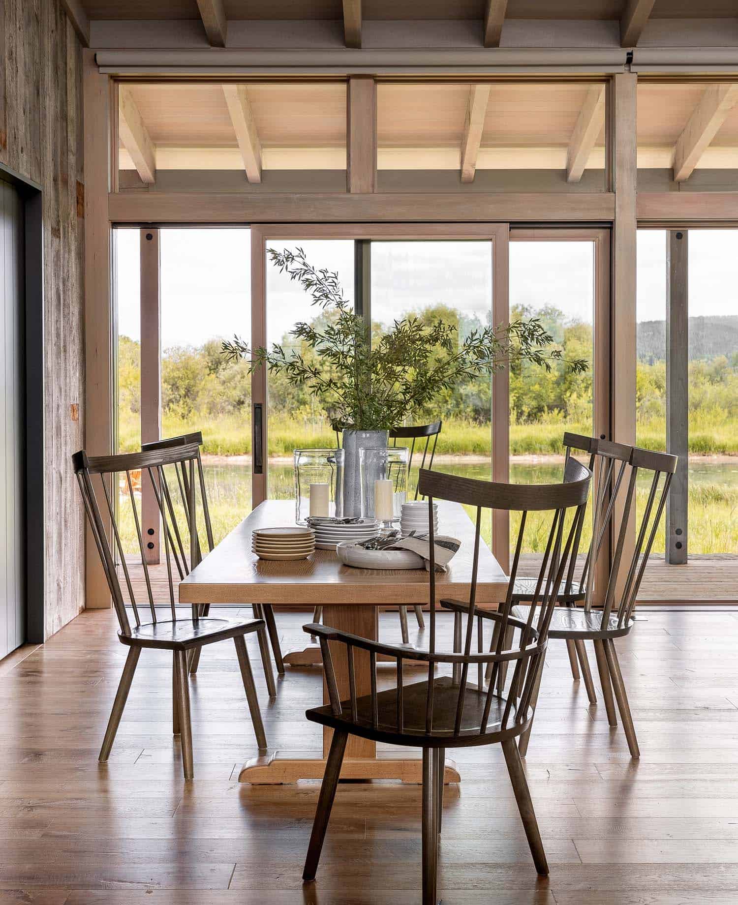 modern rustic dining room with a window view