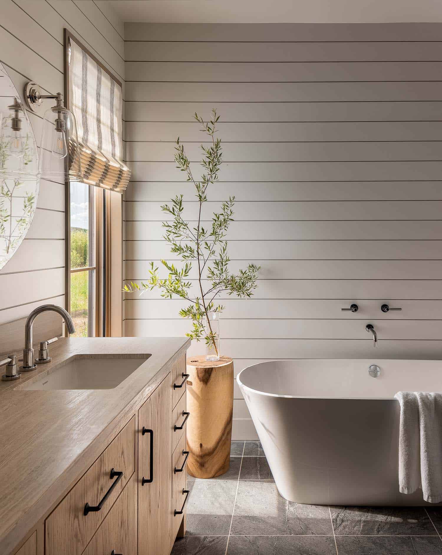 modern rustic bathroom vanity with a freestanding tub