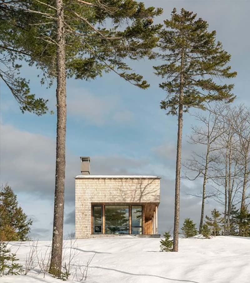 modern ski house exterior with snow