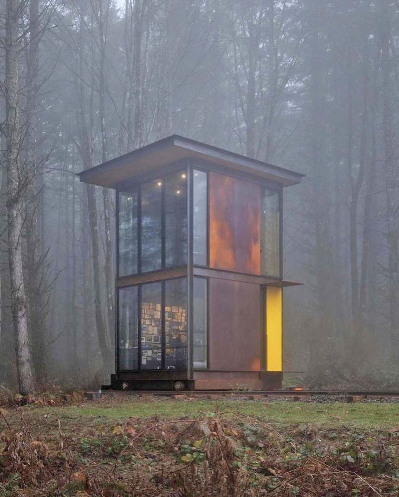 Amazing Washington forest house with a steel tower office on train tracks