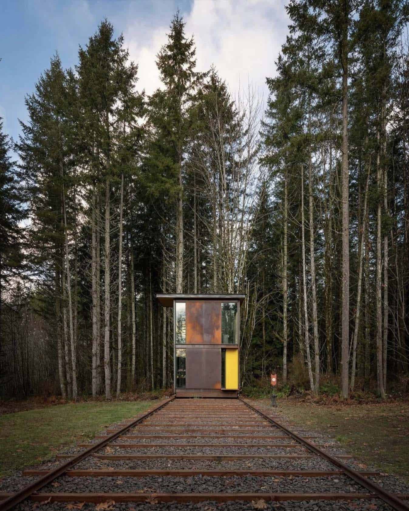 modern steel tower home office exterior in the forest