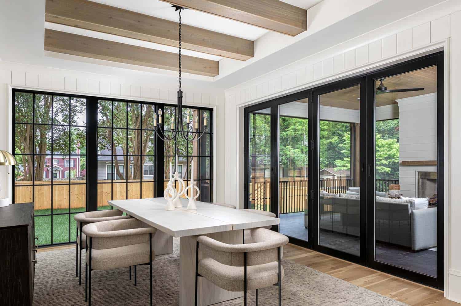modern dining room with sliding glass doors on two sides