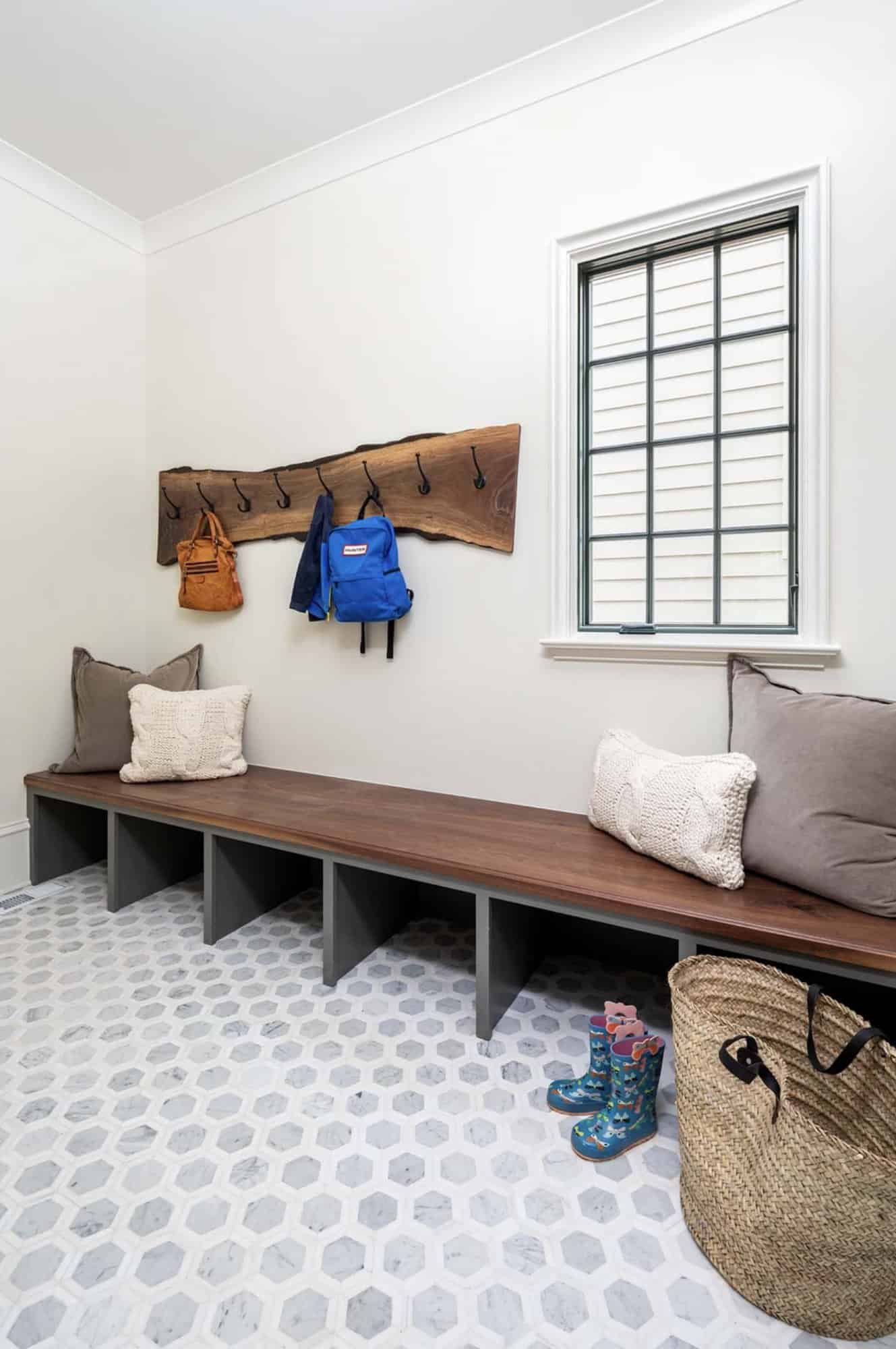 modern mudroom with a built-in bench