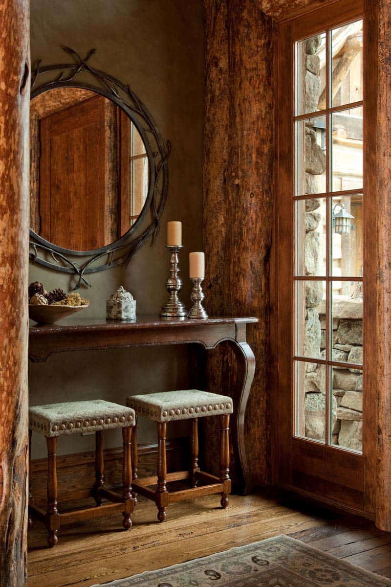 rustic mountain house entry with a console table