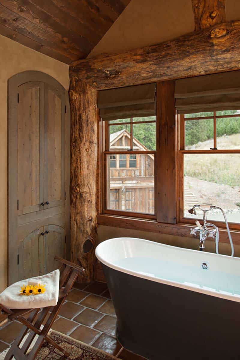 rustic bathroom with a freestanding tub