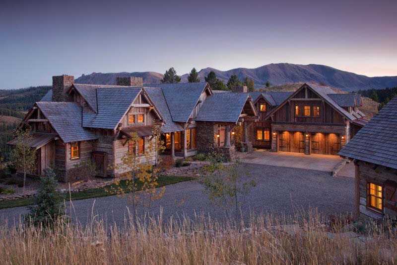 rustic mountain house exterior at dusk