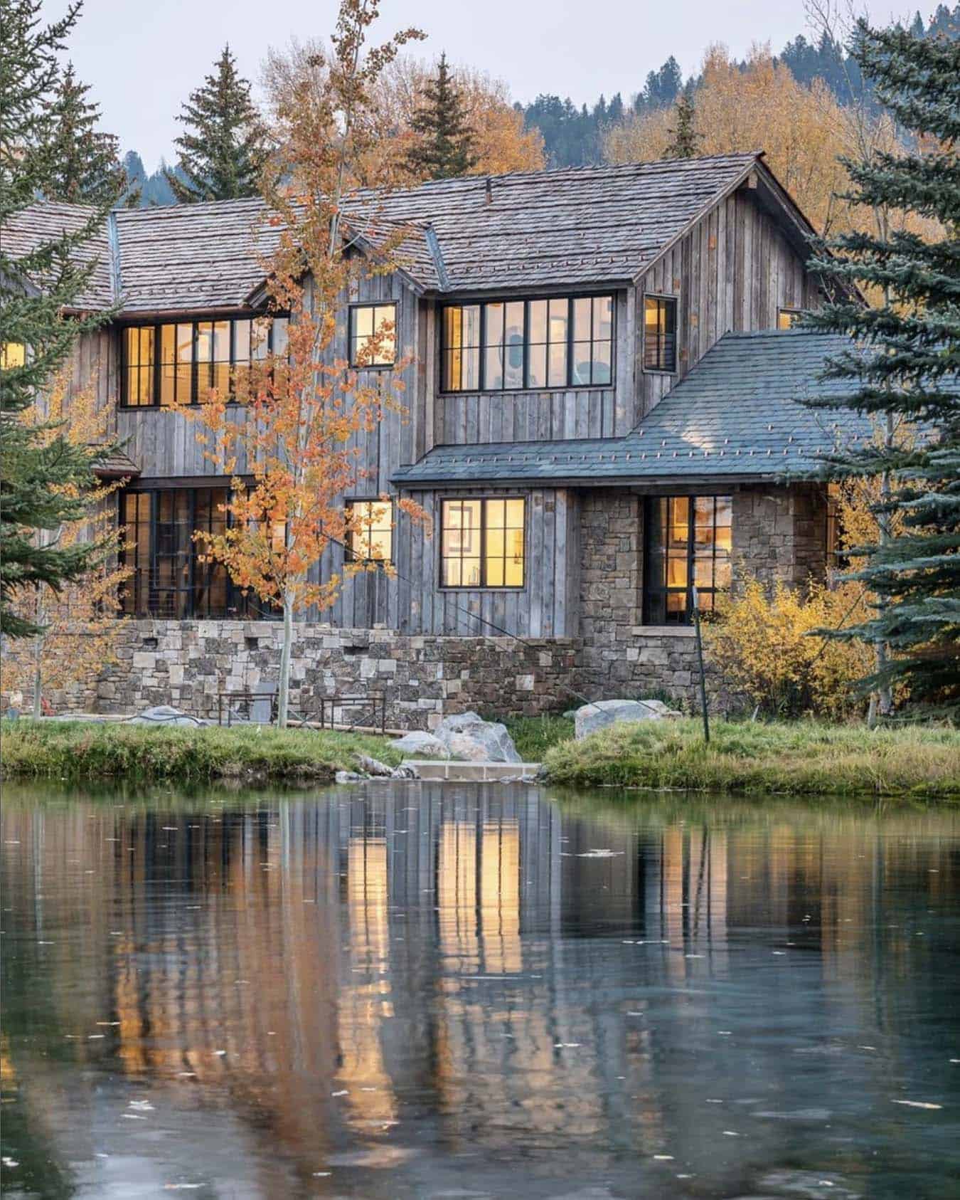 rustic mountain house exterior with a water view