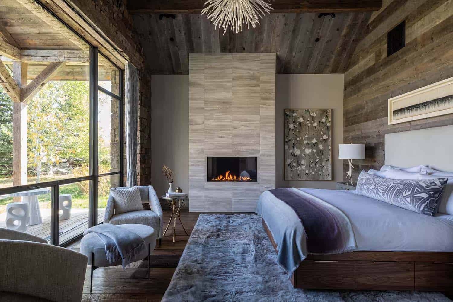 modern rustic bedroom with a fireplace