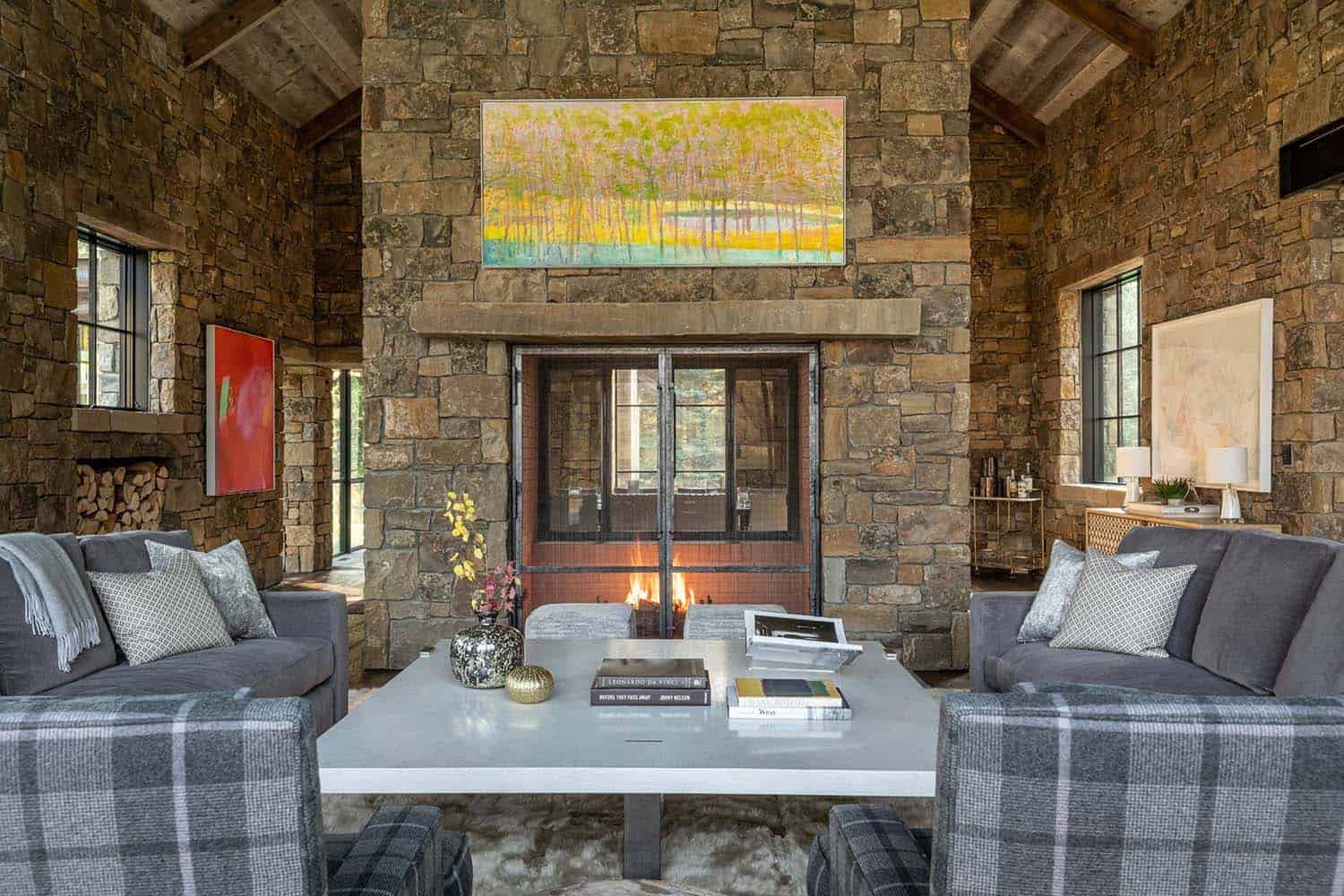 rustic living room with a dual sided fireplace