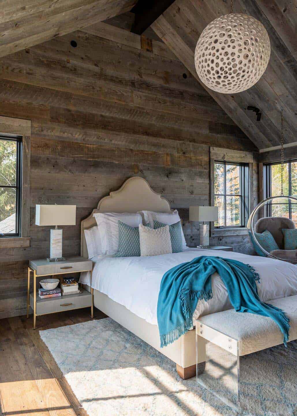 rustic bedroom with a hanging chair