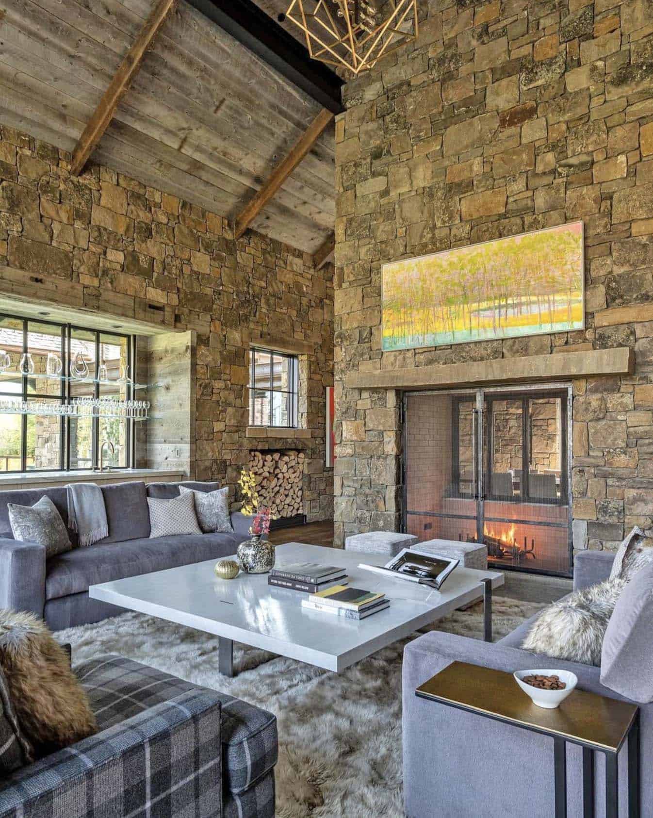 rustic living room with a dual sided fireplace