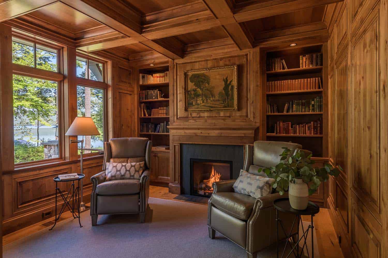 traditional home library with a fireplace