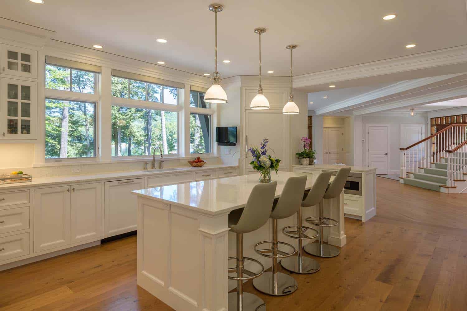 traditional kitchen with pendant lights over the island