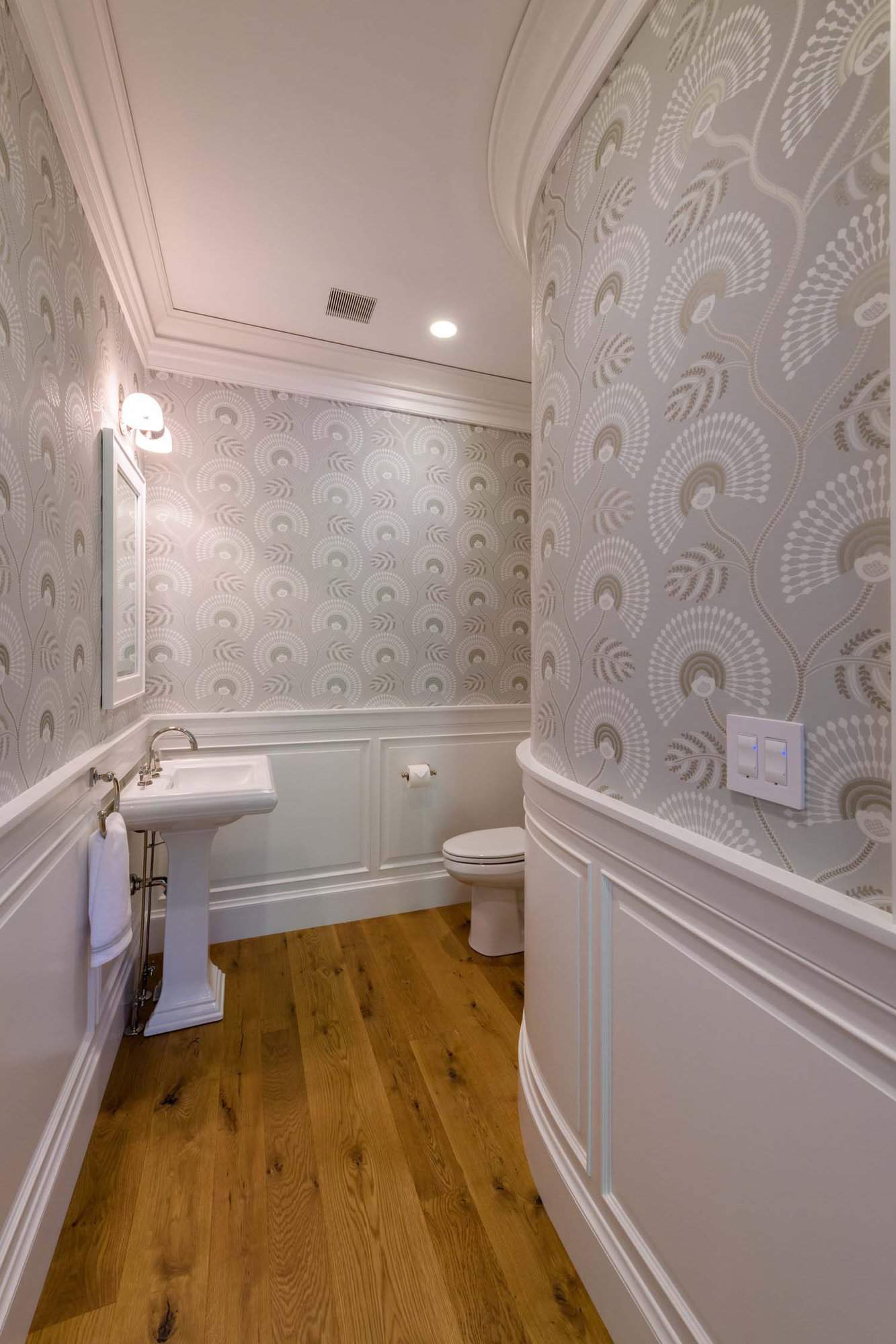 traditional powder room with wallpaper