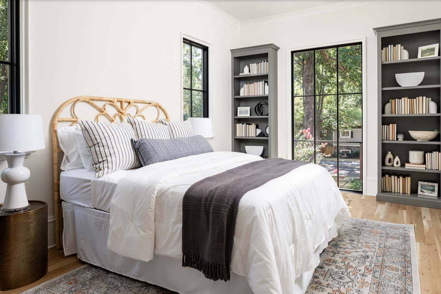 transitional style bedroom with built-in wall storage and a large window