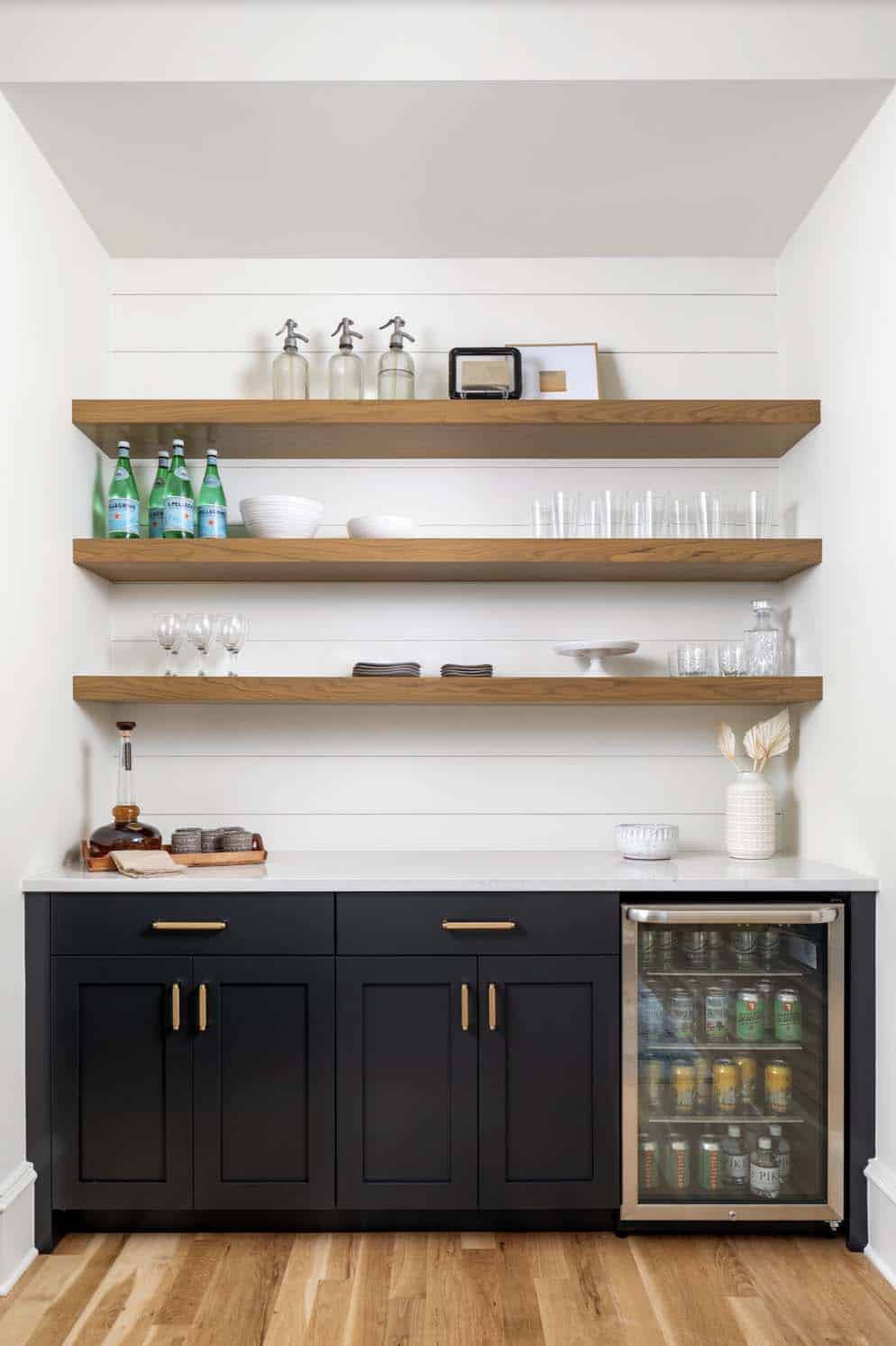 transitional style home bar with open shelves