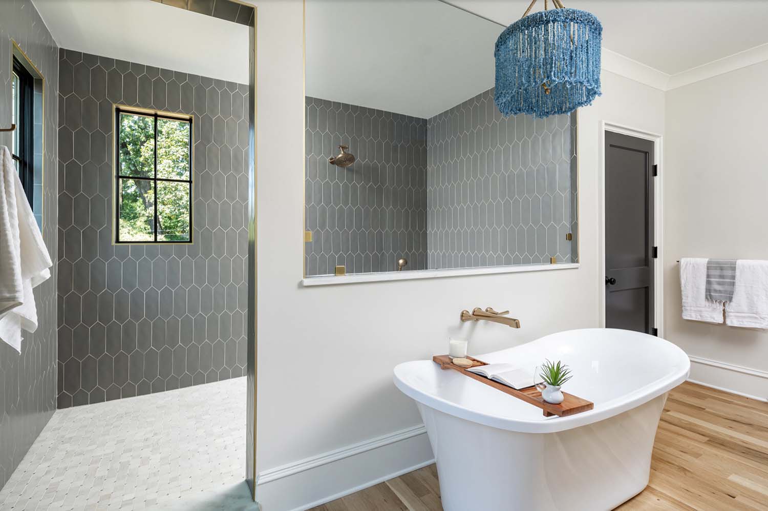 transitional style bathroom with a freestanding tub and a walk-in shower