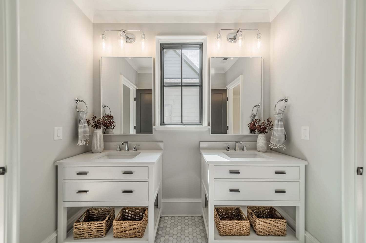 transitional style bathroom with dual vanities