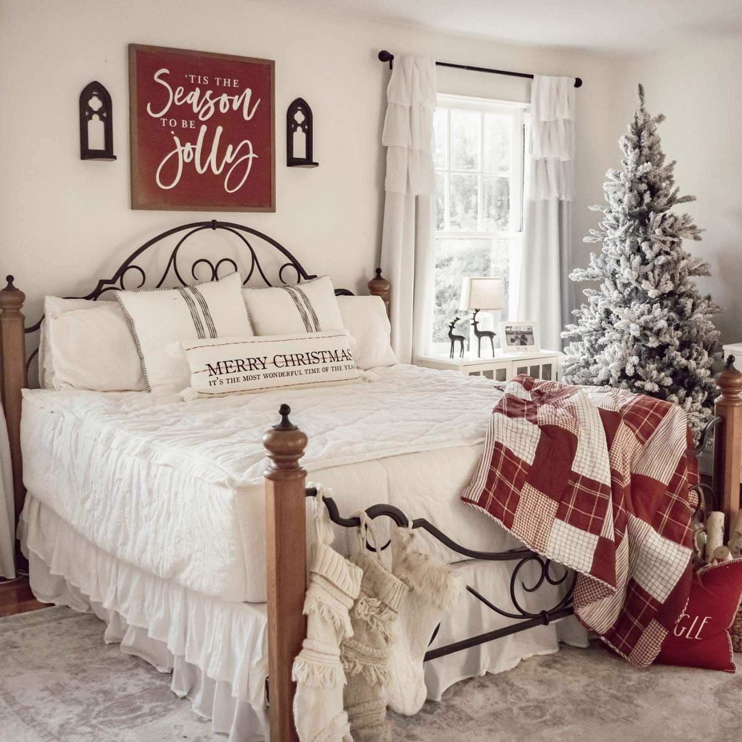 christmas decorated bedroom in red and white color palette