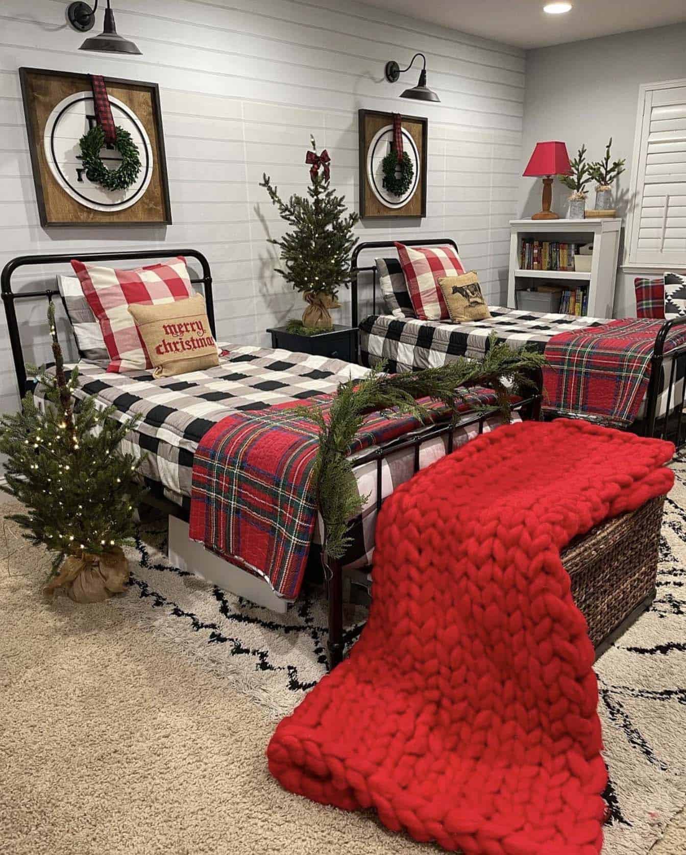 boy's bedroom decorated for Christmas with plaid bedding and a red chunky knit throw