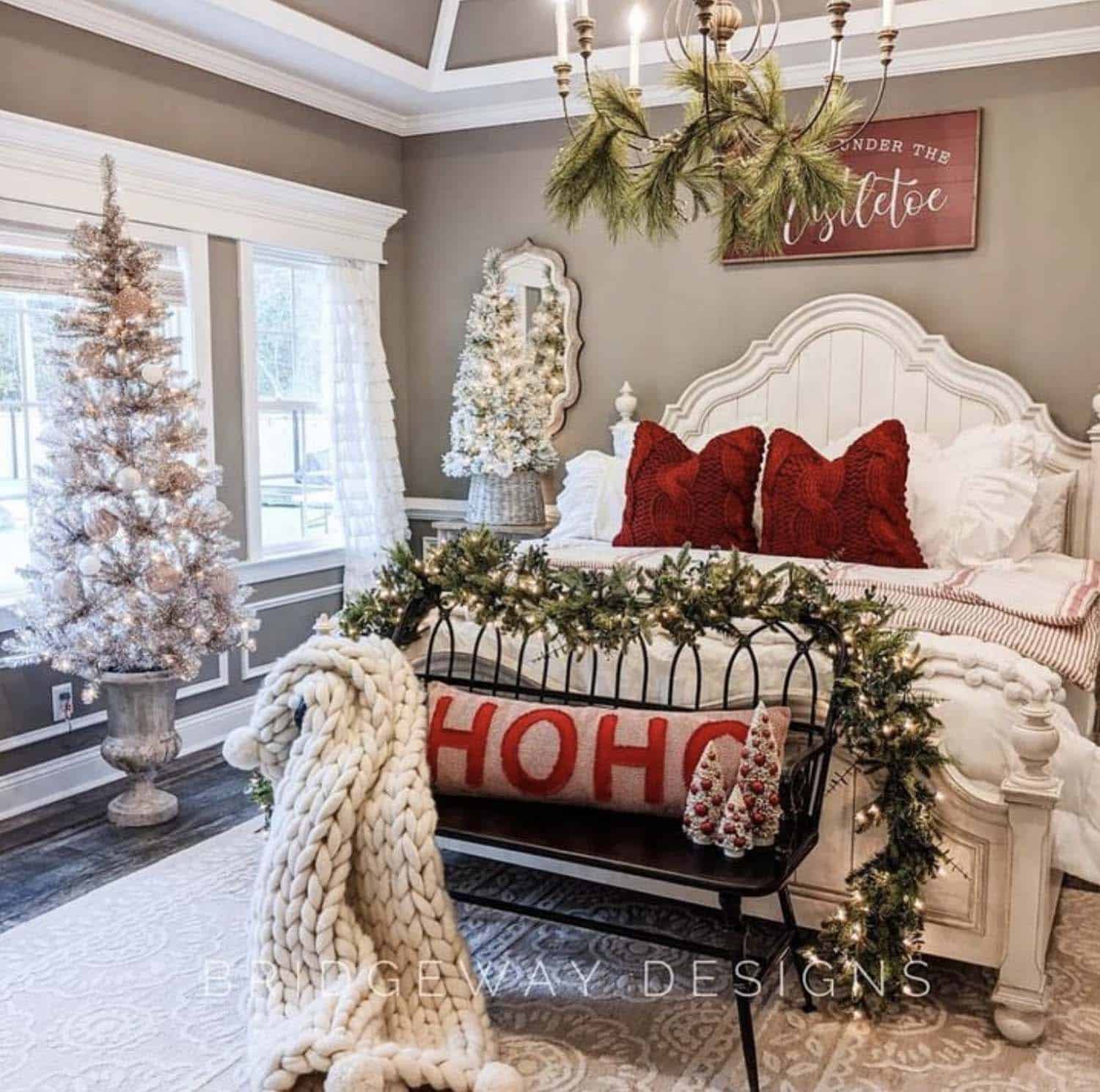 christmas decorated bedroom with pillows, a throw, garland, and a tree
